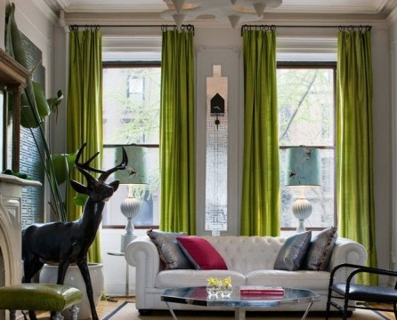 Spacious living room with green curtains