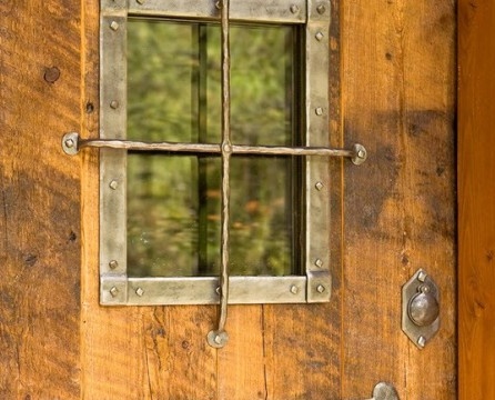 Forged metal elements on the door