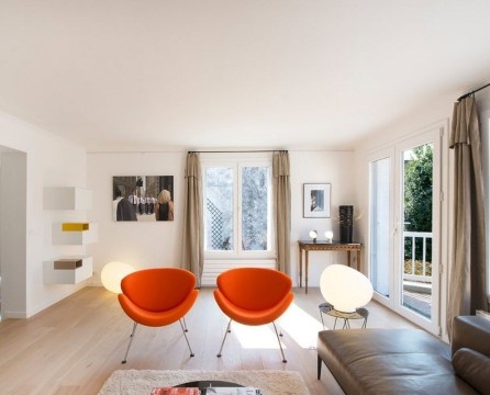 Two orange armchairs in the hall