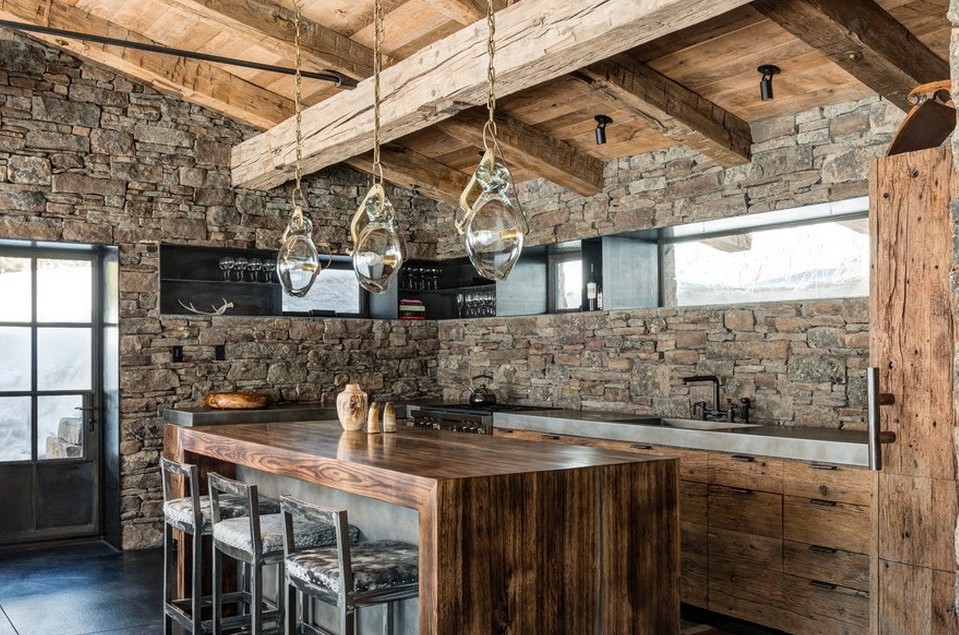 Kitchen area with stone wall