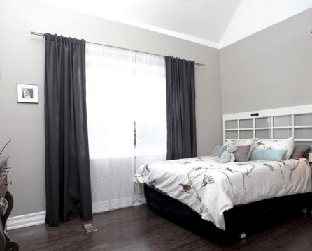 Dark laminate and light gray bedroom walls