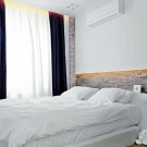 Wall decoration with artificial stone in the bedroom