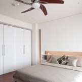 Disign a bedroom with a built-in wardrobe with one side wall