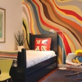 Original bright design of one wall of a room for a boy