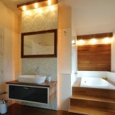 The interior of the bathroom where the bathtub is recessed in the podium
