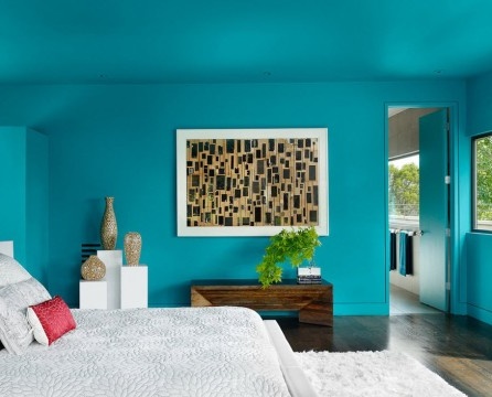 Turquoise wall in the bedroom interior