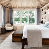 Dormitori blanc de neu amb un disseny de fusta