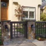 The gate should be located opposite the entrance to the house
