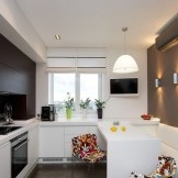 White sofa in the high-tech kitchen