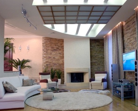 Unusual ceiling solution for a round living room