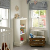 Striped roller blinds in the nursery