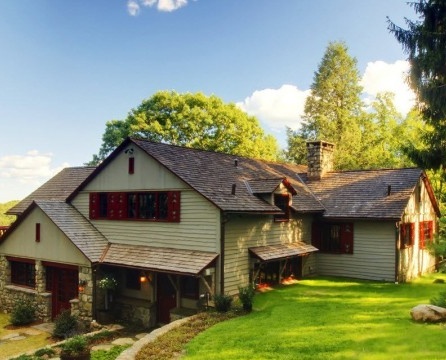 Country house by the lake made of wood and stone