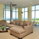 Yellow curtains in a high-tech living room