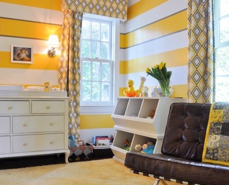 Bright yellow stripes on the walls of the nursery
