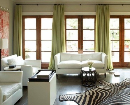 Spacious room with green curtains