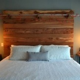White bed with wooden headboard