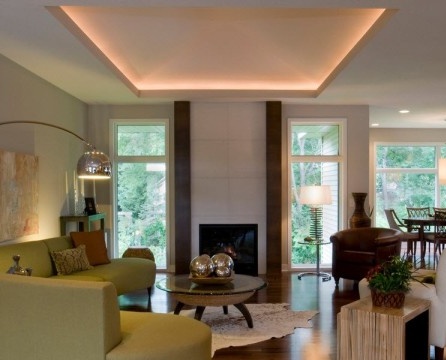 Illuminated ceiling and fireplace with white tiles