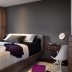 Capçalera de color gris fosc al capçal del llit