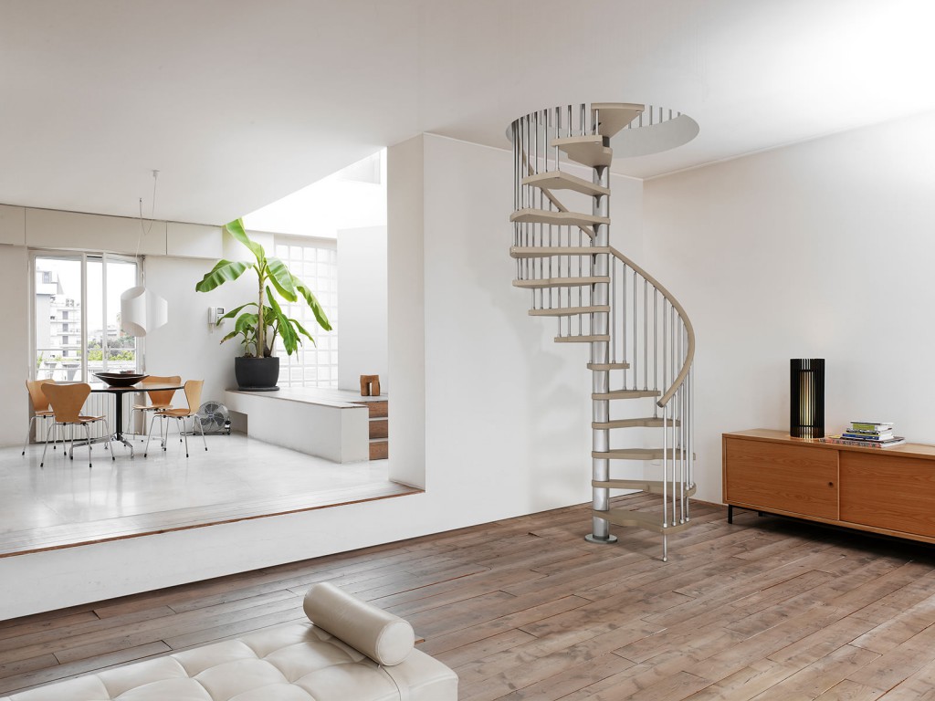 A spiral staircase does not take up much space in the living room