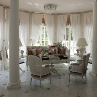 White living room with French-style columns