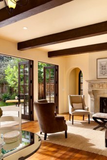 Beige walls in the living room with a French-style fireplace
