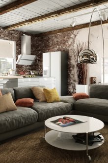 Modular gray sofa in a modern living room-kitchen