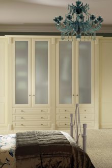 Beige wardrobe and chest of drawers in the bedroom