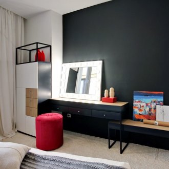 Red accents in a black and white bedroom