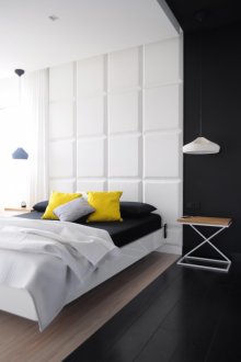 Unusual black and white bedroom with yellow accents