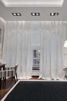 Black and white bedroom with a workplace