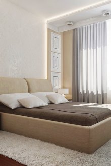 Beige bed in the bedroom