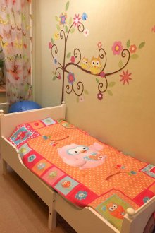 Light bright bedspread for a nursery