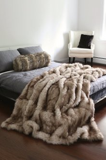 Natural fur bedspread in the bedroom