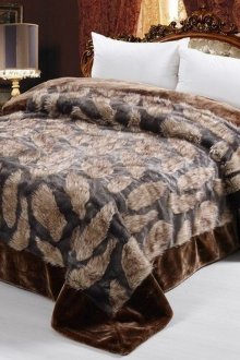 Bedspread with fur inserts in the bedroom