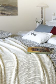 Light cream knitted bedspread