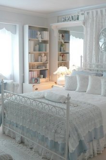 White and blue knitted bedspread in the bedroom