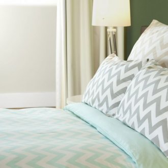 Mint white bedspread in the bedroom