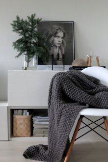 Dark gray knitted bedspread in the bedroom