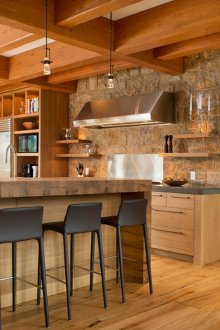 Brown country style kitchen with breakfast bar