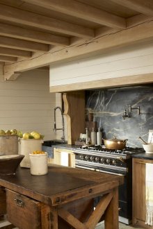 Beige-brown kitchen made of wood and stone