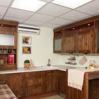 Cream brown country style kitchen with peninsula