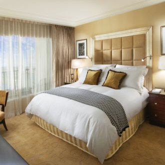 White, black and sand colors in the bedroom interior
