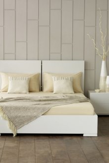 Brown flooring in a beige and white bedroom