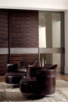 Brown-mirrored facade of the wardrobe in the living room