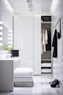 White glossy wardrobe in the interior