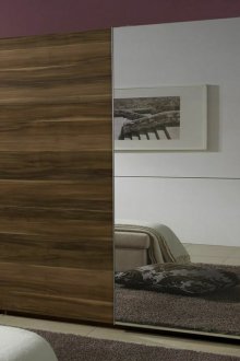 Brown sliding wardrobe with a mirror door