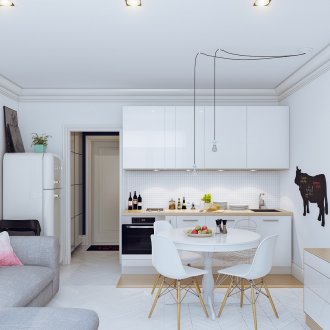 Beige and white kitchen with gray sofa.