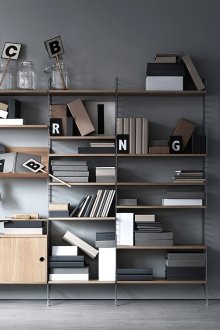 Brown bookcase in a gray interior
