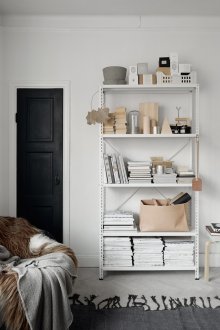 White metal shelving in scandinavian interior