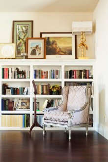 White shelving in an art deco style living room